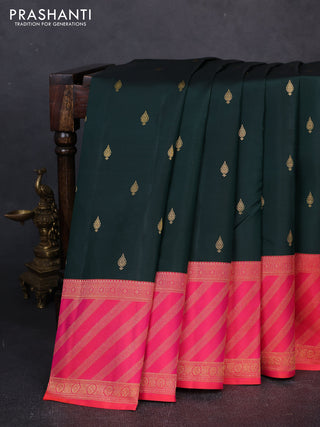 Pure kanchipuram silk saree bottle green and orange with allover zari woven buttas and long zari woven border