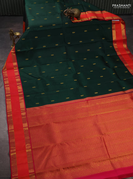 Pure kanchipuram silk saree bottle green and tomato pink with zari woven buttas and rettapet zari woven border