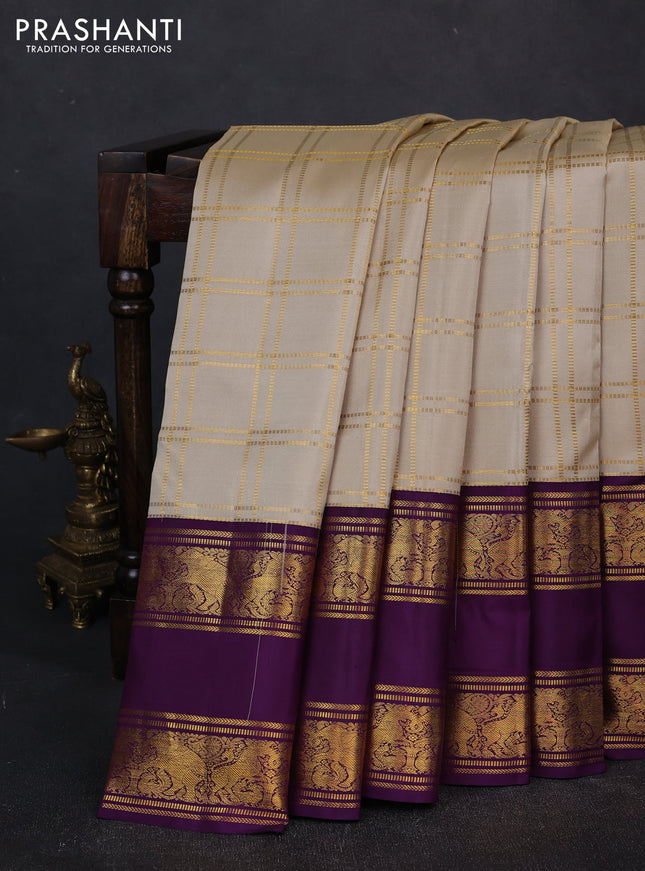 Pure kanchipuram silk saree beige and purple with allover zari checked pattern and long rettapet zari woven border