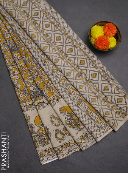 Kalamkari semi silk saree mustard yellow and beige with allover prints and printed border