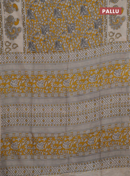 Kalamkari semi silk saree mustard yellow and beige with allover prints and printed border