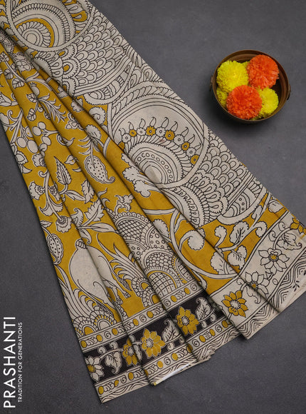 Kalamkari semi silk saree mustard yellow and black with allover prints and printed border