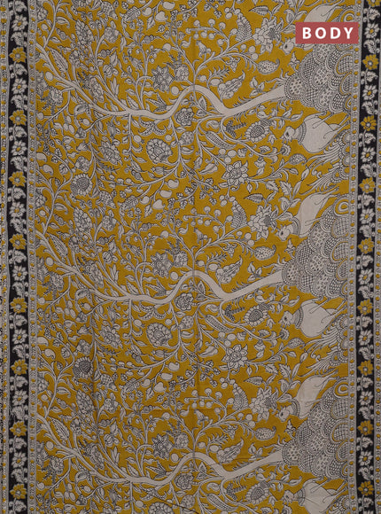 Kalamkari semi silk saree mustard yellow and black with allover prints and printed border