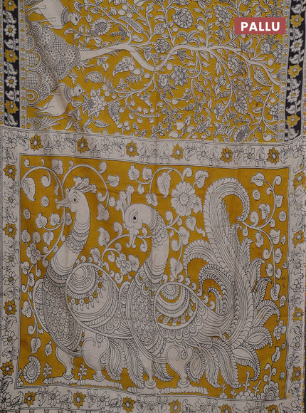 Kalamkari semi silk saree mustard yellow and black with allover prints and printed border