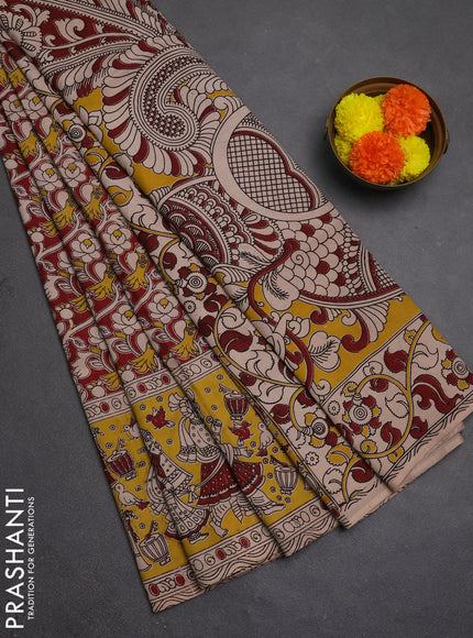 Kalamkari semi silk saree maroon and yellow with allover prints and printed border