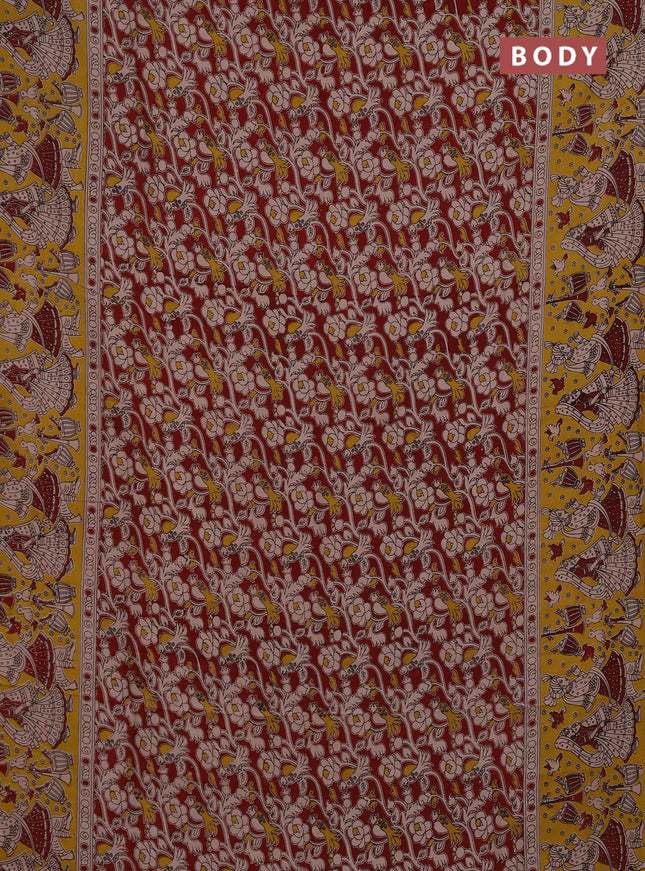 Kalamkari semi silk saree maroon and yellow with allover prints and printed border