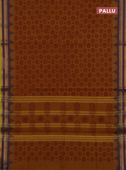 Chettinad cotton saree dark mustard and light green with allover butta prints and temple design zari woven border