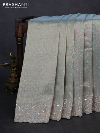 Crush Tissue Saree pastel blue shade with allover zari buttas and sequin & zardosi embroidery border