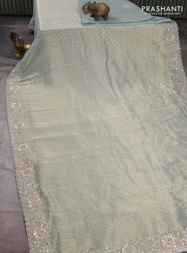 Crush Tissue Saree pastel blue shade with allover zari buttas and sequin & zardosi embroidery border