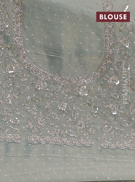 Crush Tissue Saree pastel blue shade with allover zari buttas and sequin & zardosi embroidery border