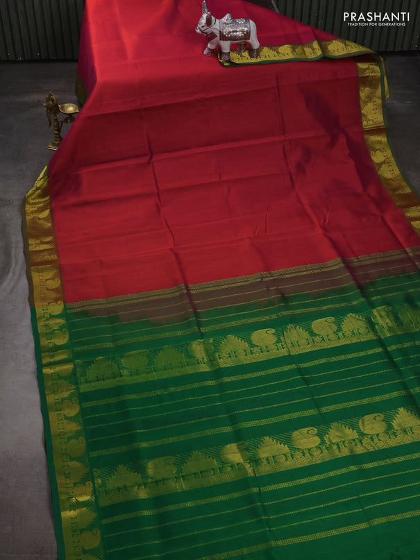Silk cotton saree dual shade of pink and green with plain body and paisley & temple zari woven border