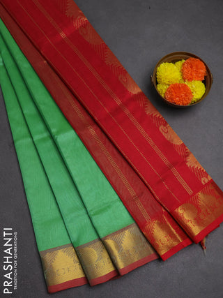 Silk cotton saree green and red with plain body and paisley & temple zari woven border