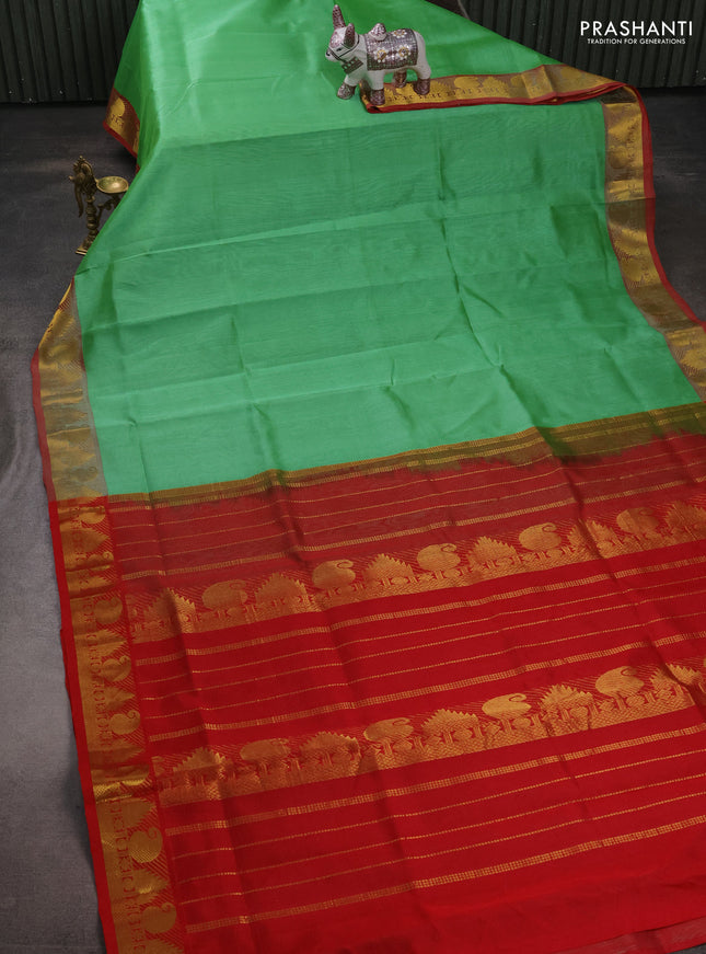 Silk cotton saree green and red with plain body and paisley & temple zari woven border