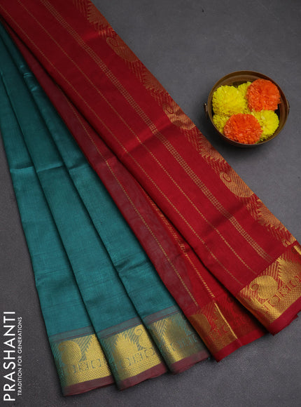 Silk cotton saree teal green shade and maroon with plain body and paisley & temple zari woven border