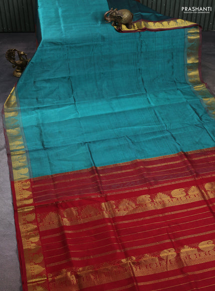 Silk cotton saree teal green shade and maroon with plain body and paisley & temple zari woven border