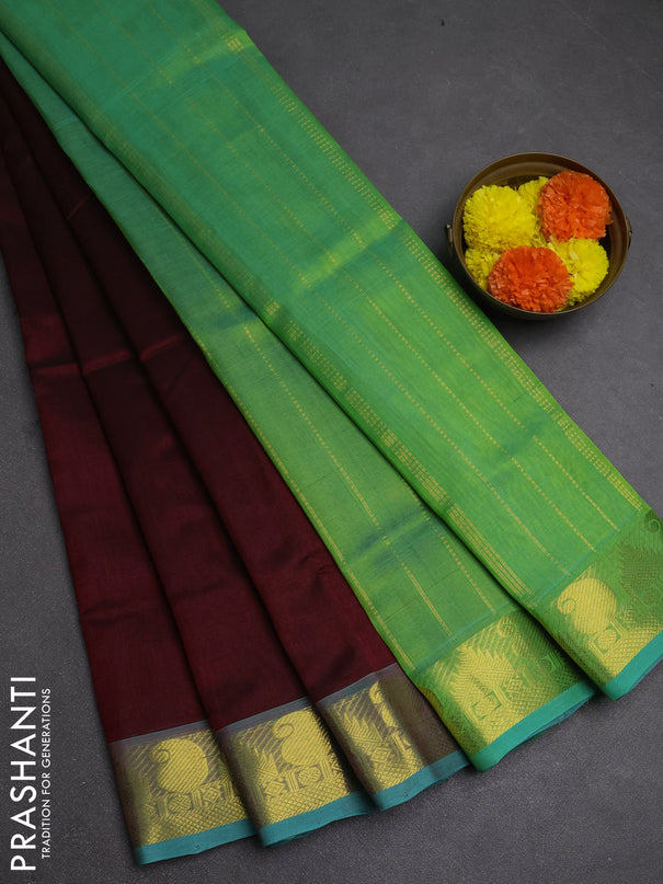 Silk cotton saree maroon and dual shade of green with plain body and paisley & temple zari woven border