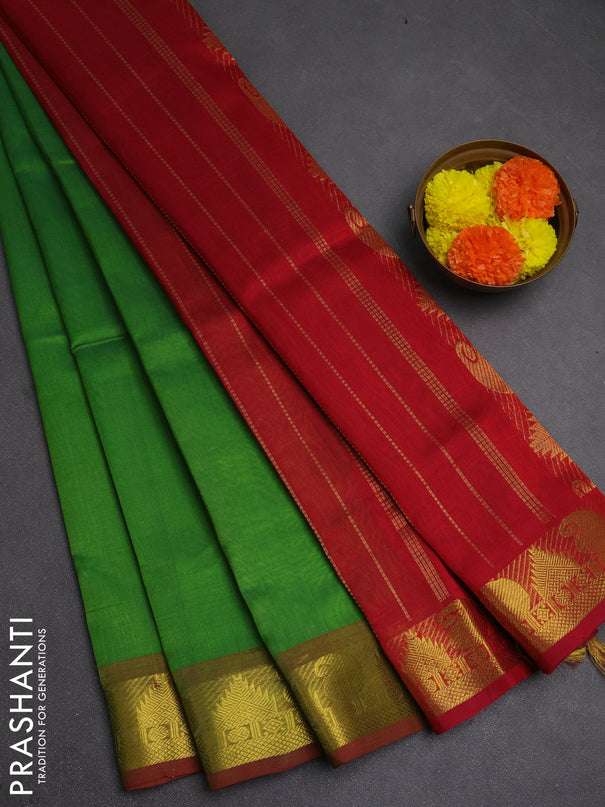 Silk cotton saree green and maroon with plain body and paisley & temple zari woven border