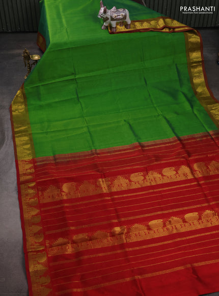 Silk cotton saree green and maroon with plain body and paisley & temple zari woven border