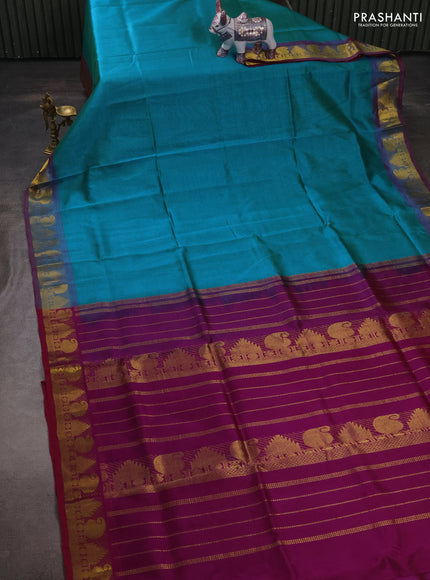 Silk cotton saree dual shade of teal blue and purple with plain body and paisley & temple zari woven border