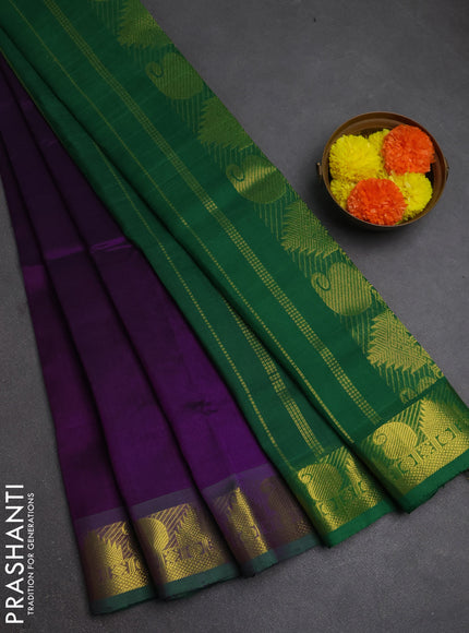 Silk cotton saree purple and green with plain body and paisley & temple zari woven border