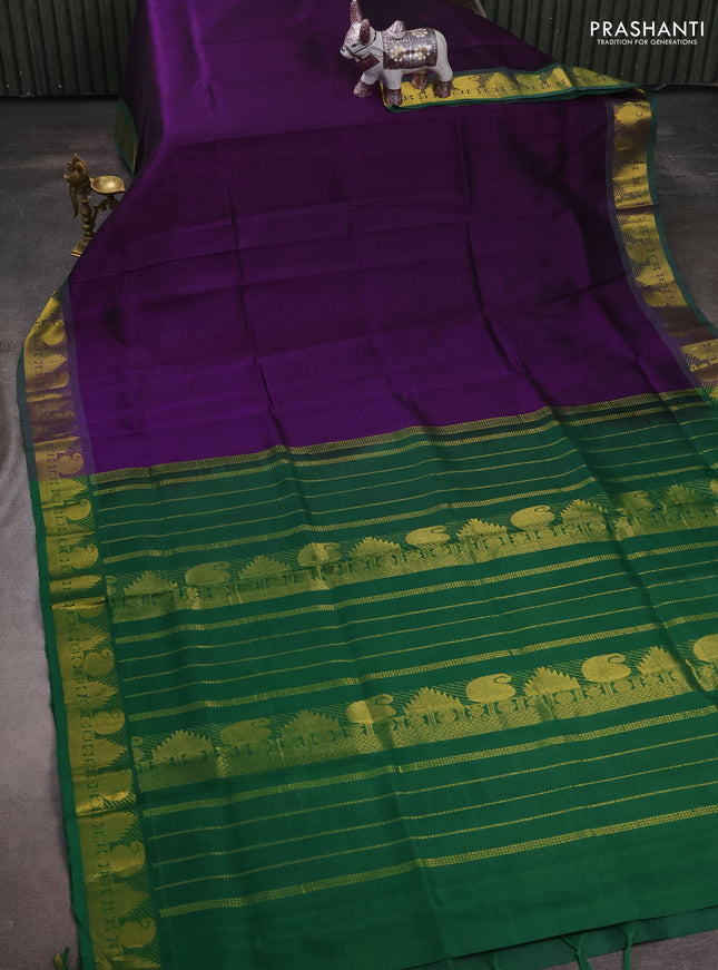 Silk cotton saree purple and green with plain body and paisley & temple zari woven border