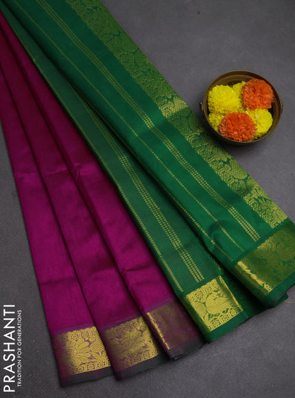 Silk cotton saree magenta pink and green with plain body and peacock zari woven border
