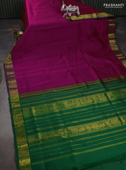 Silk cotton saree magenta pink and green with plain body and peacock zari woven border