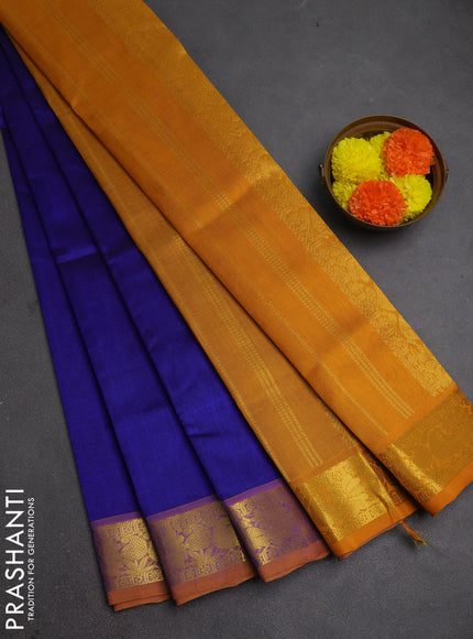 Silk cotton saree blue and mustard yellow with plain body and peacock zari woven border