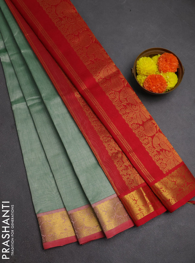 Silk cotton saree pastel green and red with plain body and peacock zari woven border