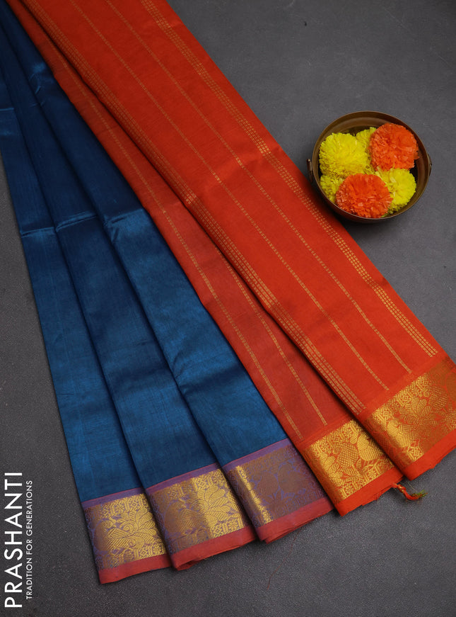 Silk cotton saree cs blue and orange with plain body and peacock zari woven border