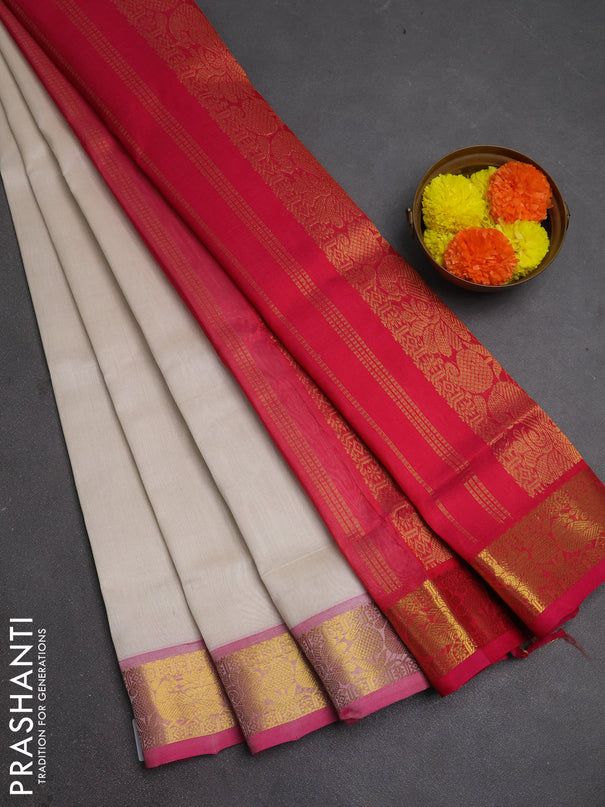 Silk cotton saree off white and pink with plain body and peacock zari woven border