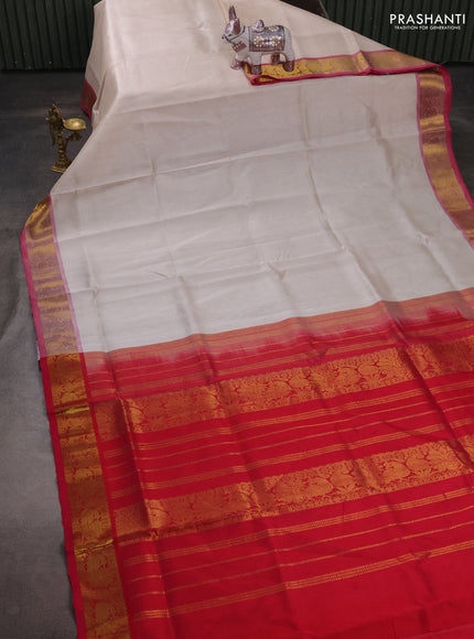 Silk cotton saree off white and pink with plain body and peacock zari woven border