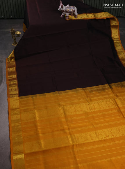 Silk cotton saree coffee brown and mustard yellow with plain body and peacock zari woven border