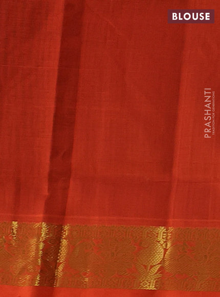 Silk cotton saree coffee brown and orange with plain body and peacock zari woven border