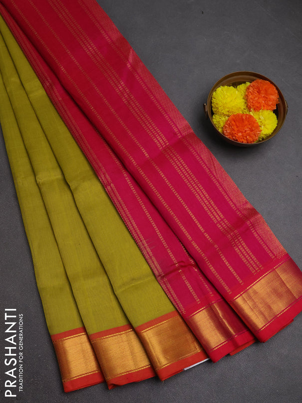 Silk cotton saree mustard green shade and pink with plain body and zari woven border
