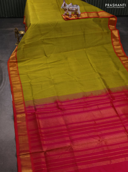 Silk cotton saree mustard green shade and pink with plain body and zari woven border
