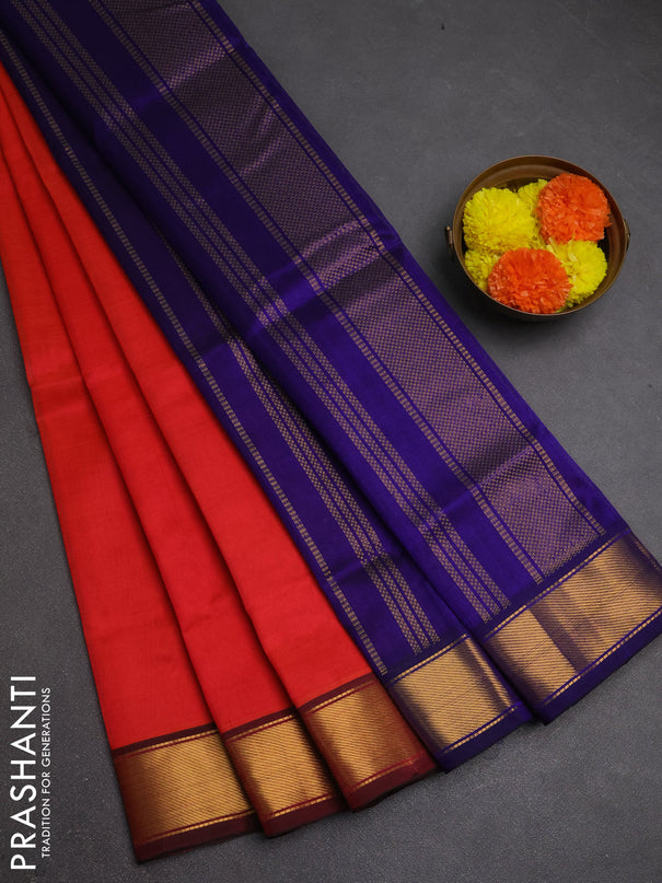 Silk cotton saree dual shade of pinkish orange and blue with plain body and zari woven border