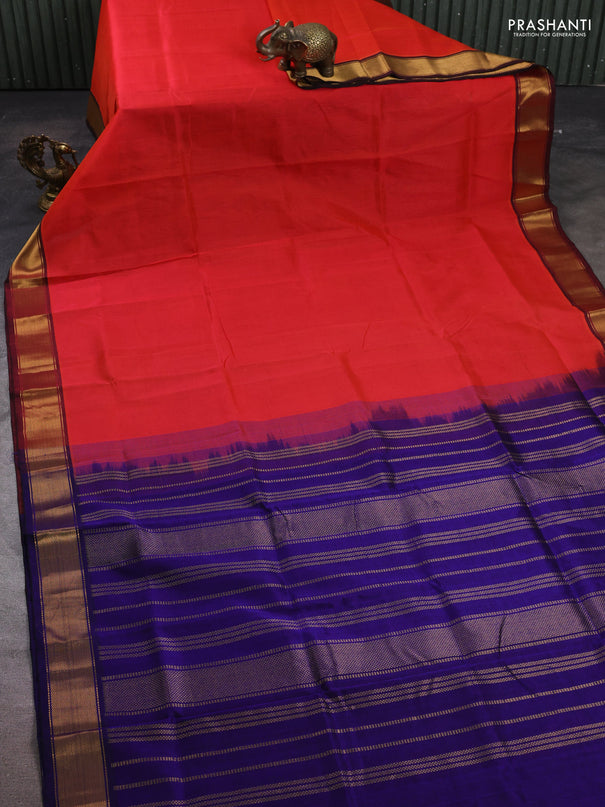 Silk cotton saree dual shade of pinkish orange and blue with plain body and zari woven border