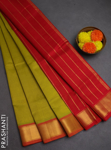 Silk cotton saree mustard green shade and red with plain body and zari woven border