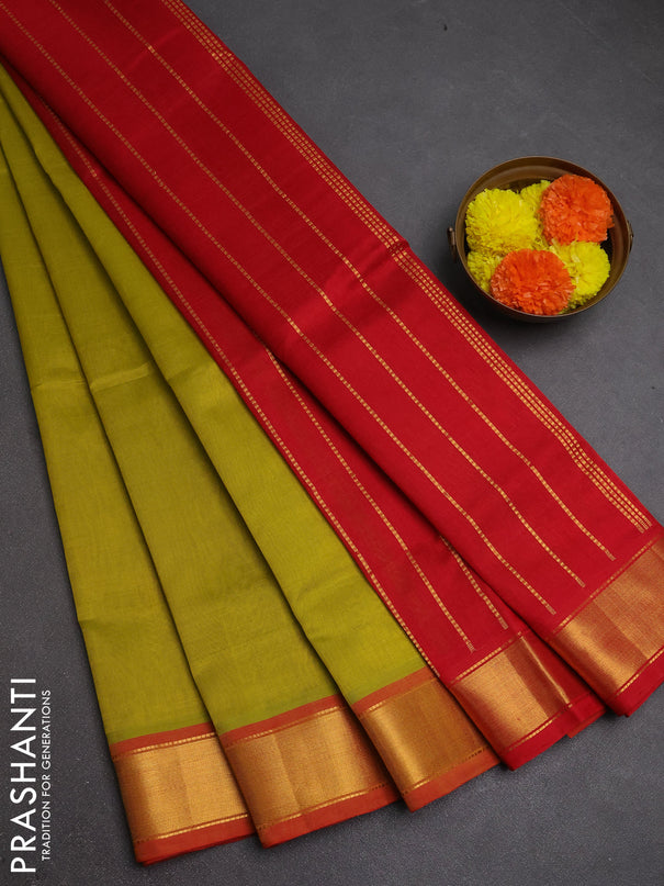 Silk cotton saree mustard green shade and red with plain body and zari woven border