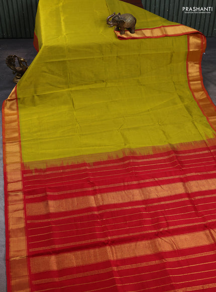 Silk cotton saree mustard green shade and red with plain body and zari woven border