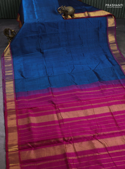 Silk cotton saree peacock blue and pink with plain body and zari woven border