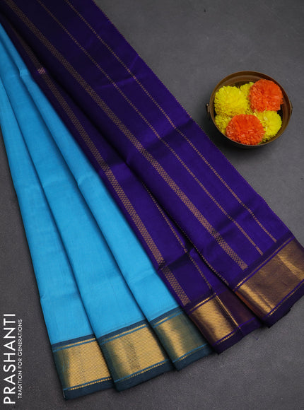 Silk cotton saree light blue and blue with plain body and zari woven border