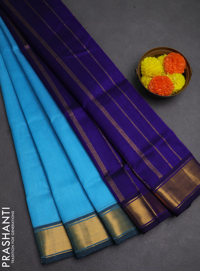 Silk cotton saree light blue and blue with plain body and zari woven border