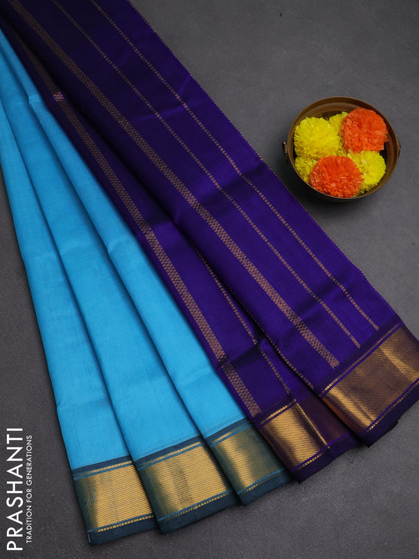 Silk cotton saree light blue and blue with plain body and zari woven border