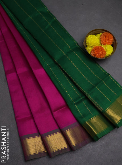 Silk cotton saree magenta pink and green with plain body and zari woven border