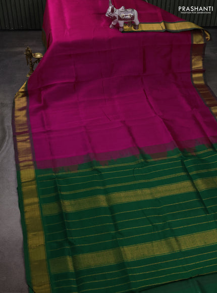 Silk cotton saree magenta pink and green with plain body and zari woven border