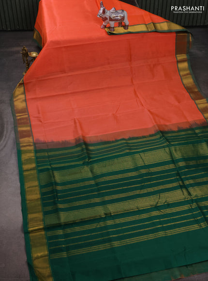 Silk cotton saree peach orange and green with plain body and zari woven border
