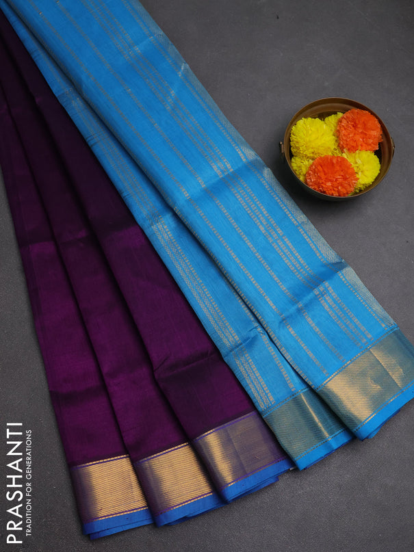 Silk cotton saree purple and cs blue with plain body and zari woven border