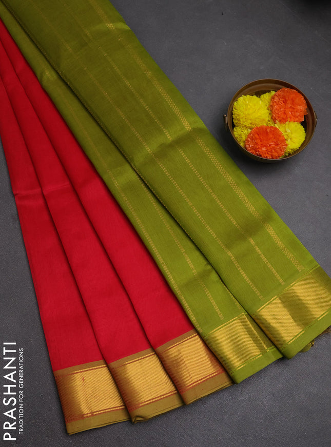 Silk cotton saree tomato pink and light green with plain body and zari woven border